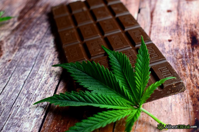 Best CBD chocolate: a chocolate bar and a hemp leaf on it.