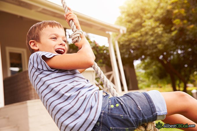CBD oil for kids: happy child. CBD oil for kids: happy child.