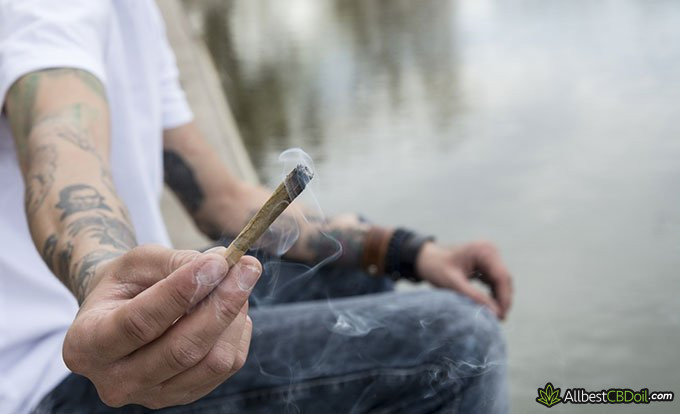 Does CBD get you high: man offering to smoke a joint