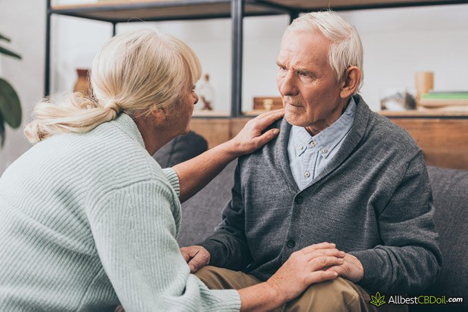 Best CBD oil for dementia: a woman talking to a senior man.