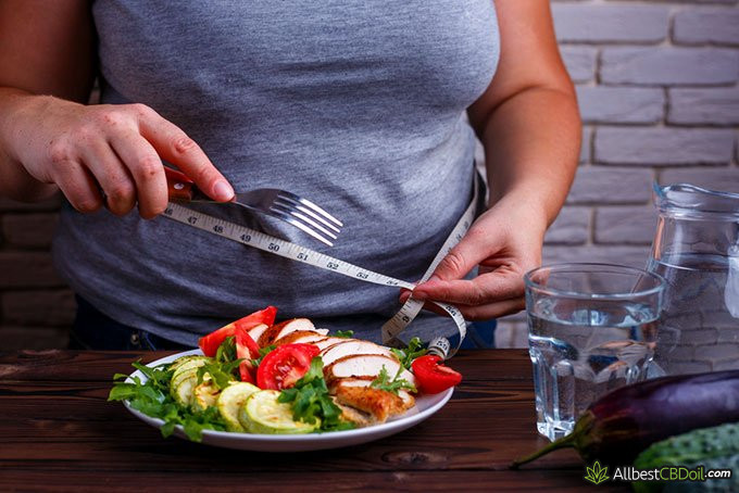 CBD oil and weight loss: overweight woman eating